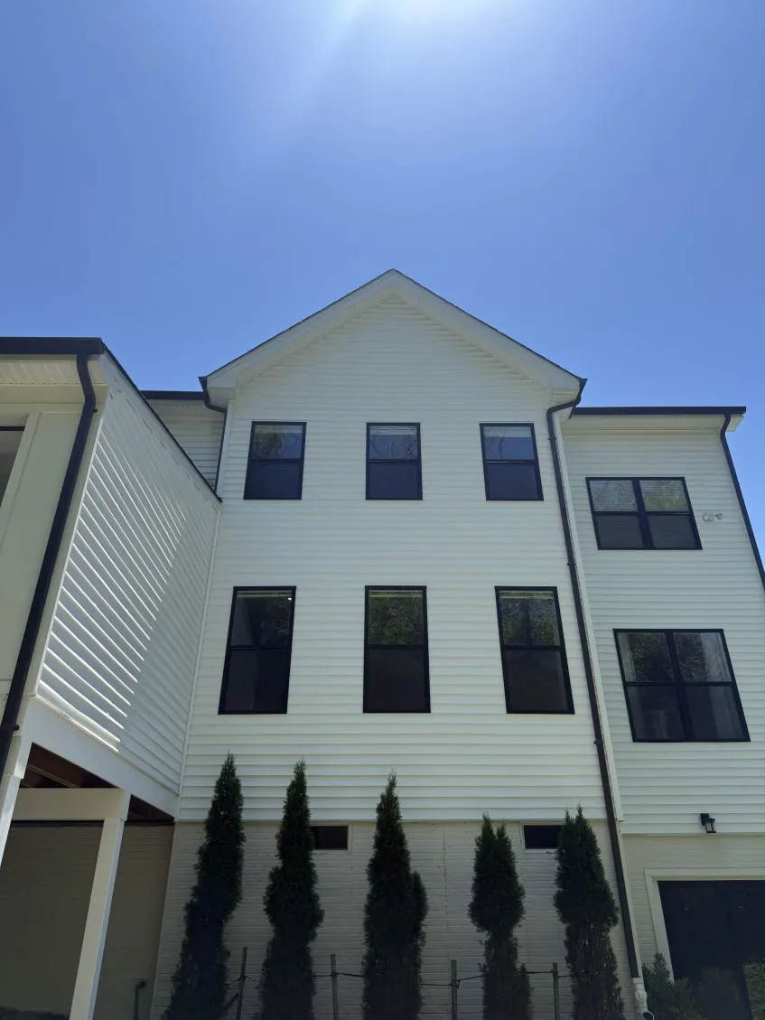Clean white house exterior after washing
